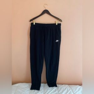 Women’s Nike “Fleece Joggers” in black, size large.